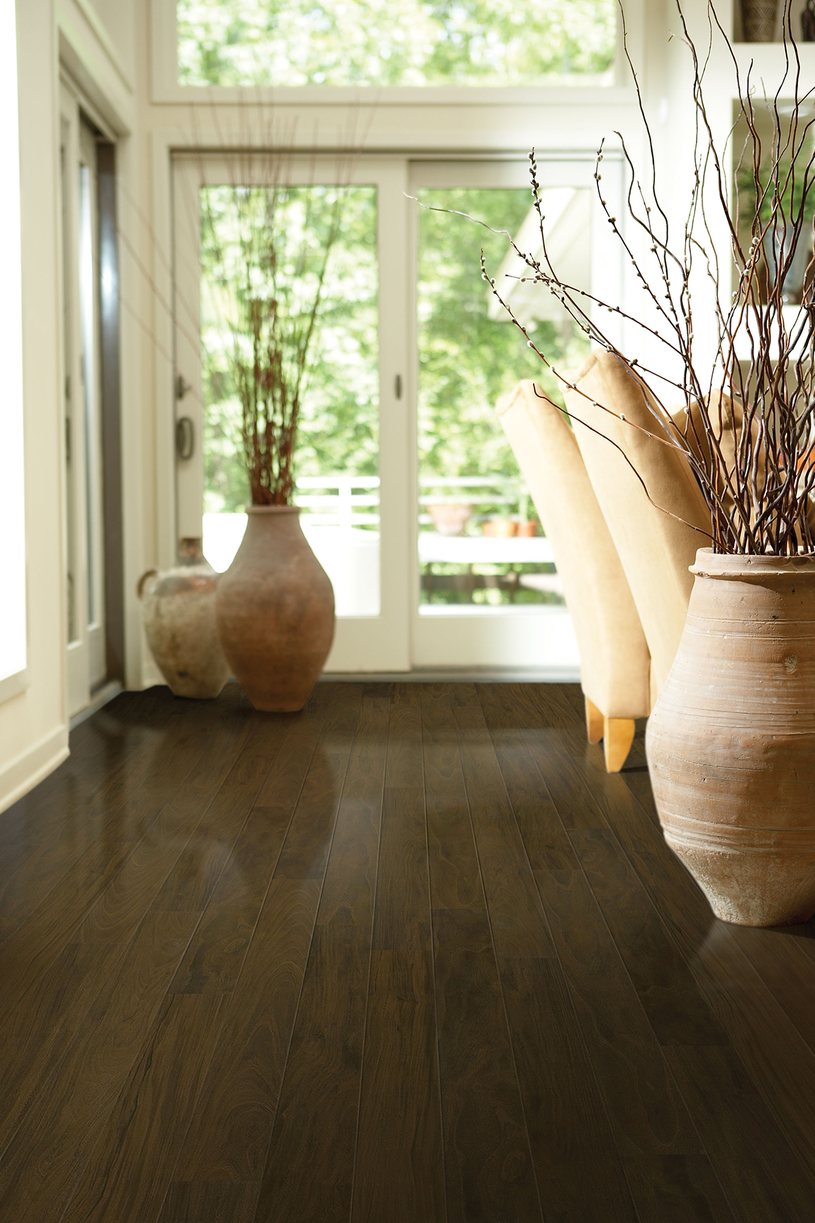 Floor Trader Wood-Look Laminate Sample in hallway featuring vases and pottery